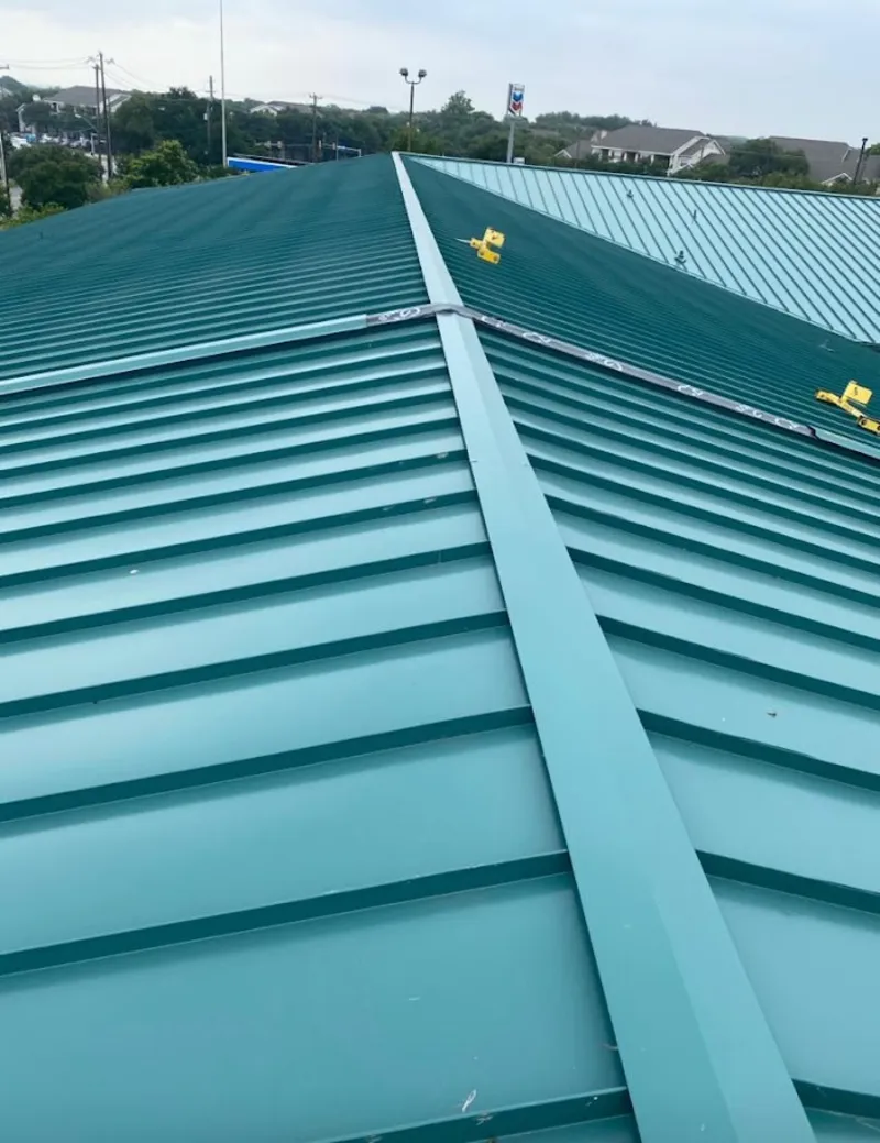 Green commercial metal roof ridge and valley for Metal Roof Repair in Bethel